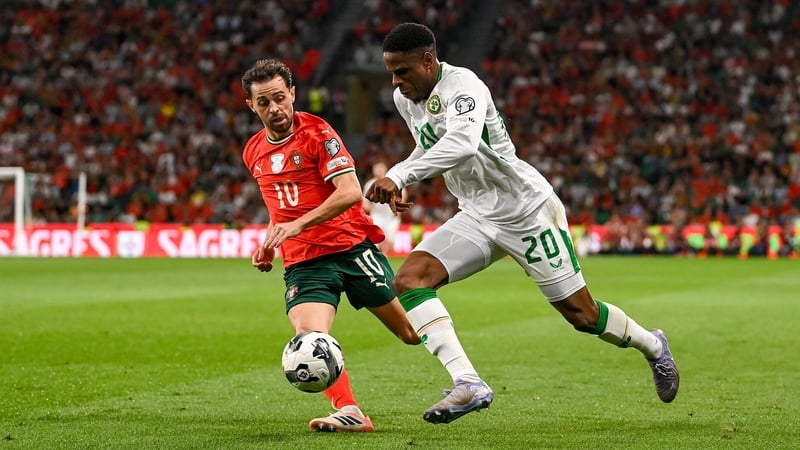 Chiedozie Ogbene (R) in action against Bernardo Silva of Portugal in Lisbon on Saturday night
