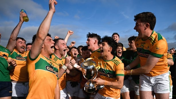 12 October 2025; The Cuchullians Dunloy team celebrate with the trophy after the Antrim County Senior Club Football Championship final match between Cuchullians Dunloy and Erin's Own Cargin at Corrigan Park in Belfast. Photo by Ramsey Cardy/Sportsfile