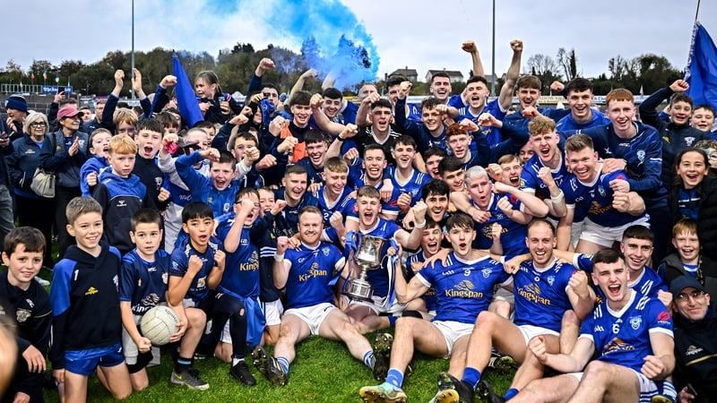 Kingscourt Stars players and supporters celebrate with the Oliver Plunkett Trophy