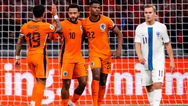 Memphis Depay of Netherlands celebrates with Justin Kluivert of Netherlands and Denzel Dumfries of Netherlands after scoring his team's third goal during the FIFA World Cup 2026 qualifier match between Netherlands and Finland at Johan Cruijff Arena on October 12, 2025 in Amsterdam, Netherlands.