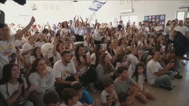 Friends and families of Israeli hostages gather to watch their release live
