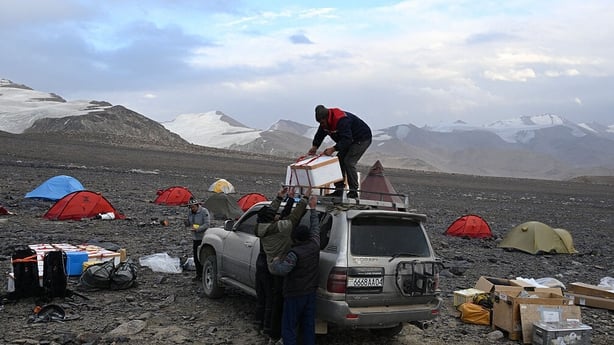Members of "Pamir Ice memory" expedition set their gear at the foot of Pamir Glacier on September 25, 2025, eastern Tadjikistan