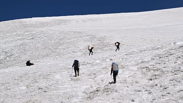 Members of the expedition "Pamir-Ice-Memory" climbing up Pamir Glacier