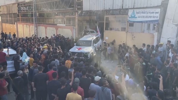 Red Cross vehicles carrying hostages leave release site in Gaza City