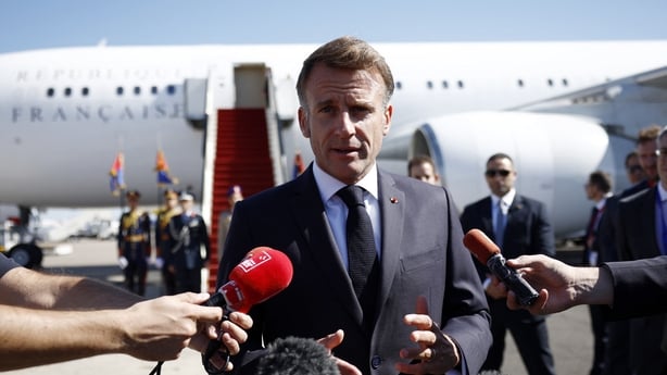 France's President Emmanuel Macron speaks to the press as he arrives for the Gaza Summit in Sharm El-Sheikh, Egypt