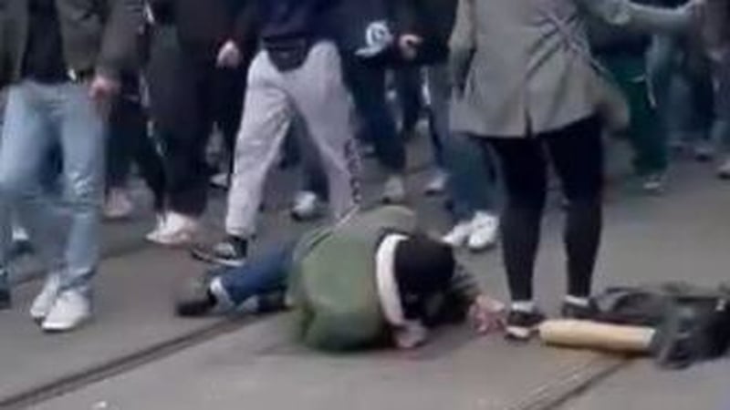Carly Clarke said she and her friend Steve (pictured on the ground) wanted to get in the middle of what she thought was a parade and take pictures