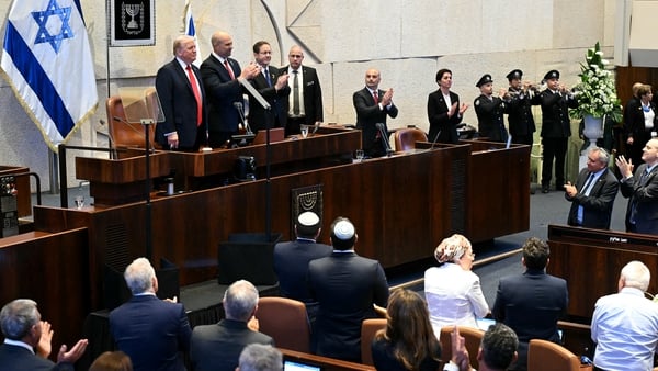 US President Donald Trump (L) receives a standing ovation in the Knesset