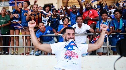 Roberto Lopes celebrates with supporters