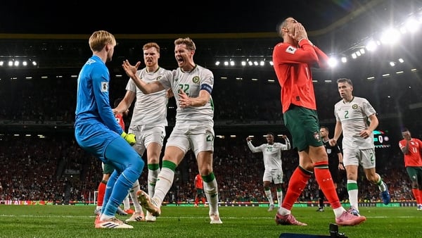 11 October 2025; Republic of Ireland goalkeeper Caoimhin Kelleher celebrates with teammates Nathan Collins, right, and Jake O'Brien, centre, after saving the penalty of Cristiano Ronaldo of Portugal during the FIFA World Cup 2026 Group F qualifying match