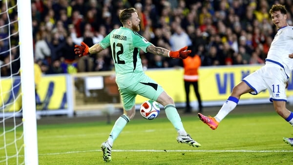Kosovo's forward #11 Fisnik Asllani (R) reacts as he scores the 0-1 goal past Sweden's goalkeeper #12 Viktor Johansson (L) during the 2026 World Cup qualifying group B football match between Sweden and Kosovo in Gothenburg, Sweden on October 13, 2025, (Ph