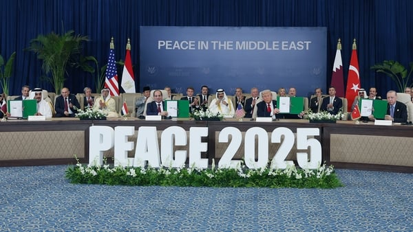 four world leaders at a peace summit in egypt behind a sign reading 'peace 2025'