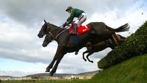 Cheltenham , United Kingdom - 12 March 2025; Stumptown, with Keith Donoghue up, right, jumps the last on their way to winning The Glenfarclas Cross Country Steeple Chase on day two of the Cheltenham Racing Festival at Prestbury Park in Cheltenham, England