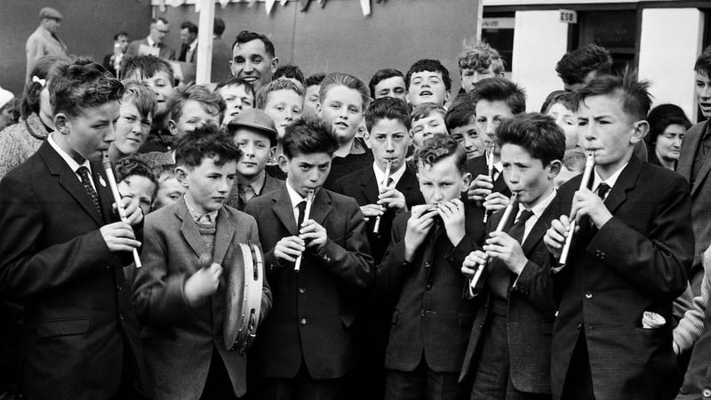 Schoolboys at Féile Castleisland, Co. Kerry, in May 1965, with whistles, mouth organ and tambourine (Photo © Kennelly Archive; published in 'Beating Time')