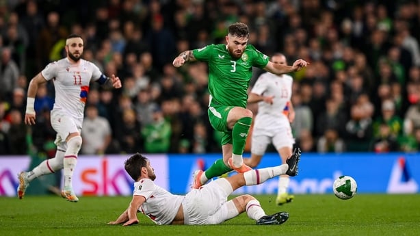 Ryan Manning of Ireland is tackled by Sergei Muradian of Armenia - World Cup qualifier, October 2025