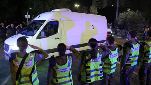 Vehicles transporting the returned bodies arrive at the National Centre for Forensic Medicine in Tel Aviv