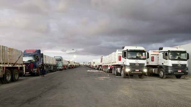 Trucks carrying humanitarian aid supplies pass through the Rafah Border Crossing