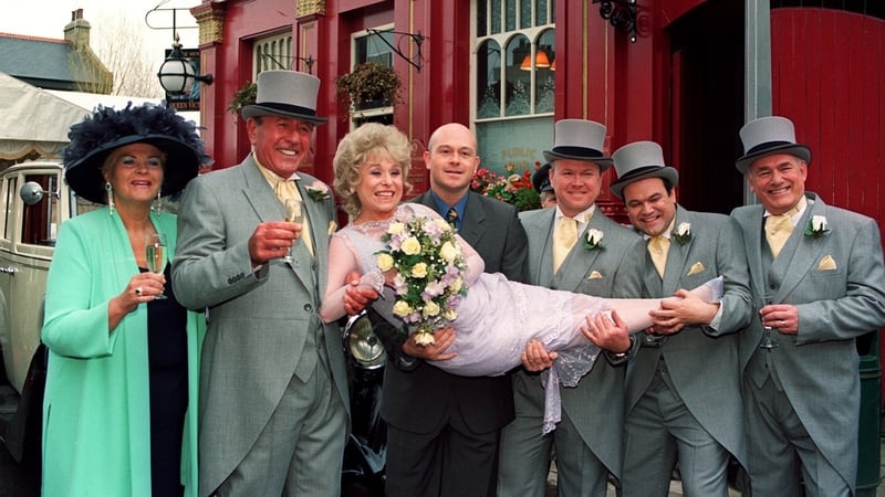 EastEnders stars (L-R): Pam St Clement, Mike Reid, Barbara Windsor, Ross Kemp, Steve McFadden, Shaun Williamson and Tony Caunter pictured outside the Queen Vic pub in 1999