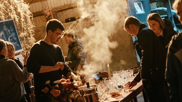 Man serving cups of cider