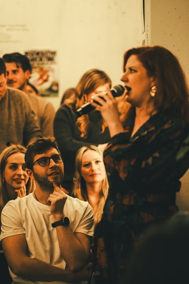 A woman telling a story to an audience