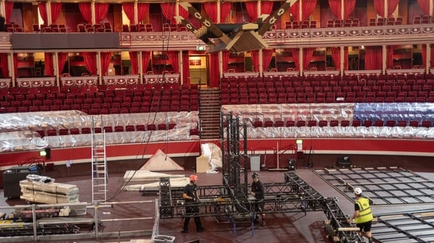 Workers build a stage at the Royal Albert Hall for the sumo tournament in London