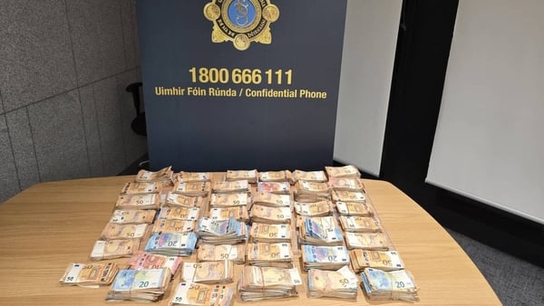 Seized cash laid out on table