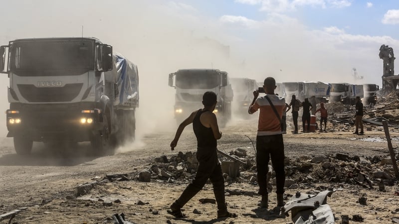 Trucks carrying food aid and fuel pass through the Kerem Shalom border crossing and arrive in Khan Younis, Gaza