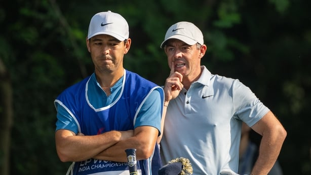 NEW DELHI, INDIA - OCTOBER 16: Rory McIlroy of Northern Ireland discusses his tee shot with his caddie on hole 15 on day one of the DP World India Championship 2025 at Delhi Golf Club on October 16, 2025 in New Delhi, India. (Photo by Jason Butler/Getty Images)