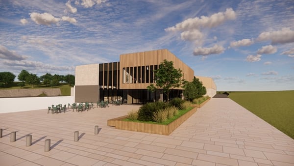 An illustration of a proposed sports campus for County Cavan. It shows a building with some wodden cladding and some green spaces