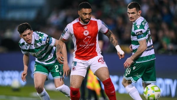 19 May 2025; Jake Mulraney of St Patrick's Athletic in action against Cory O'Sullivan, left, and Trevor Clarke of Shamrock Rovers during the SSE Airtricity Men's Premier Division match between Shamrock Rovers and St Patrick's Athletic at Tallaght Stadium