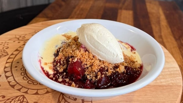 A bowl of crumble and custard