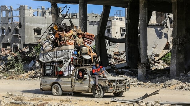 Palestinians continue to return to the southern city of Khan Younis following the ceasefire in Gaza