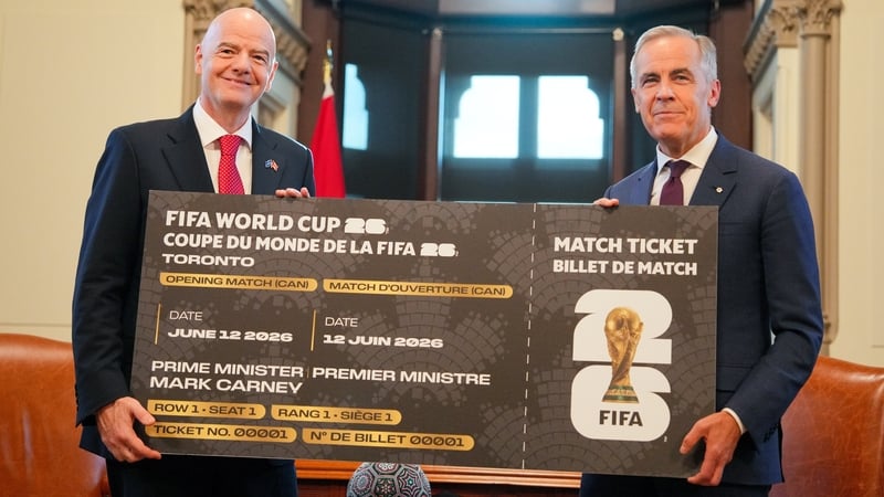 FIFA president Gianni Infantino (L) presenting Canadian prime minister Mark Carney with a novelty replica ticket last week