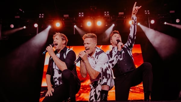 Nicky Byrne, Shane Filan and Kian Egan of Westlife performing onstage