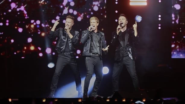 Nicky Byrne, Shane Filan and Kian Egan of Westlife performing onstage
