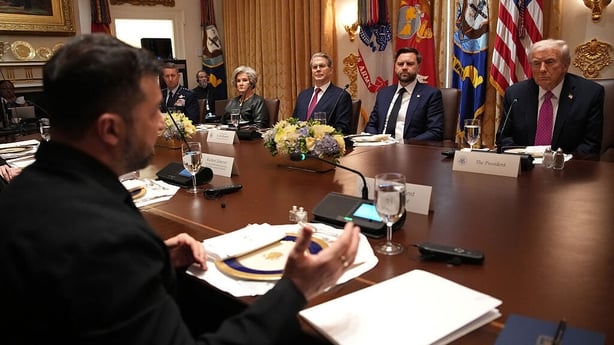 Ukrainian President Volodymyr Zelensky (L) looks on during a meeting with US President Donald Trump and members of his Cabinet
