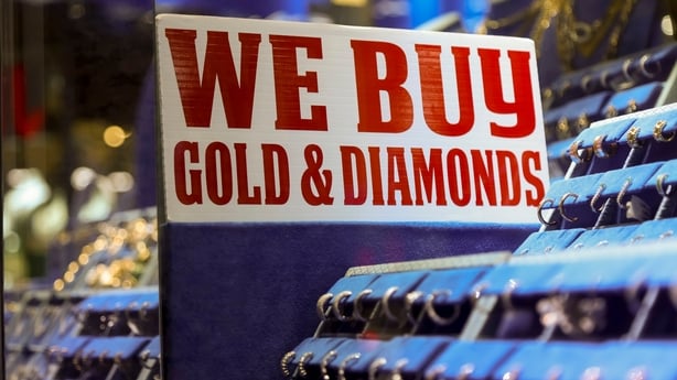 "We Buy Gold & Diamonds" signage at a jewelry shop in the Diamond District neighborhood of New York, US, on Wednesday, Oct. 8, 2025. The gold rally rippling through global markets is reverberating from trading floors down to the cramped corridors of Manhattan's Diamond District, where shop owners ha