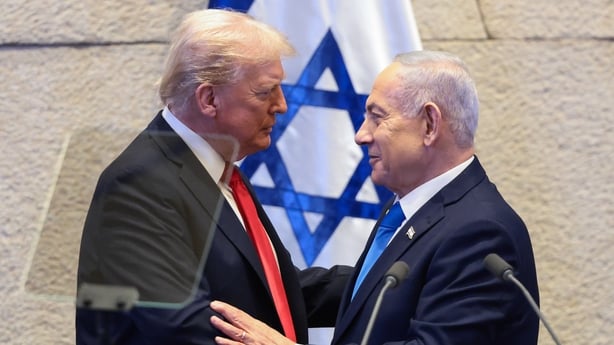 JERUSALEM - OCTOBER 13: U.S. President Donald Trump speaks with Israeli Prime Minister Benjamin Netanyahu at the Knesset, Israel's parliament, on October 13, 2025 in Jerusalem. President Trump is visiting the country hours after Hamas released the remaining Israeli hostages captured on Oct. 7, 2023,