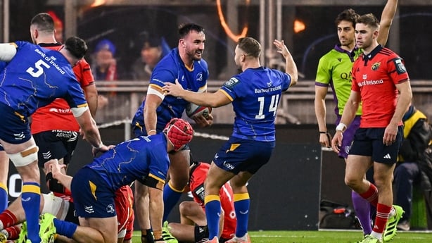 18 October 2025; Rónan Kelleher of Leinster, left, celebrates with teammate Jordan Larmour after scoring their side's first try during the United Rugby Championship match between Leinster and Munster at Croke Park in Dublin. Photo by Seb Daly/Sportsfile