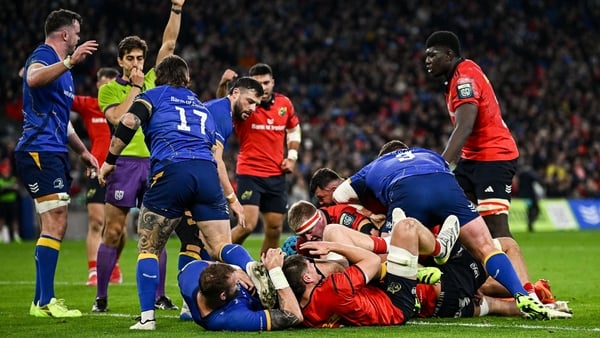 18 October 2025; Brian Gleeson of Munster, hidden, scores his side's first try during the United Rugby Championship match between Leinster and Munster at Croke Park in Dublin. Photo by Seb Daly/Sportsfile