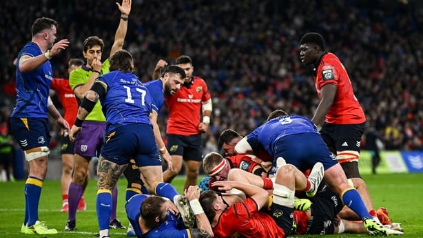 18 October 2025; Brian Gleeson of Munster, hidden, scores his side's first try during the United Rugby Championship match between Leinster and Munster at Croke Park in Dublin. Photo by Seb Daly/Sportsfile