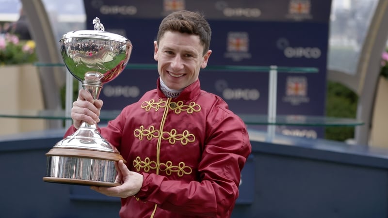 Jockey Oisin Murphy poses with the trophy after being crowned champion jockey during the QIPCO British Champions Day at Ascot