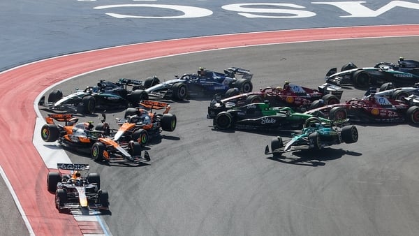 AUSTIN, TX - OCTOBER 17: McLaren Formula 1 Team driver Lando Norris (4) of the United Kingdom and McLaren Formula 1 Team driver Oscar Piastri (81) of Australia collide as Stake F1 Team Kick Sauber driver Nico Hulkenberg (27) of Germany and Aston Martin Ar