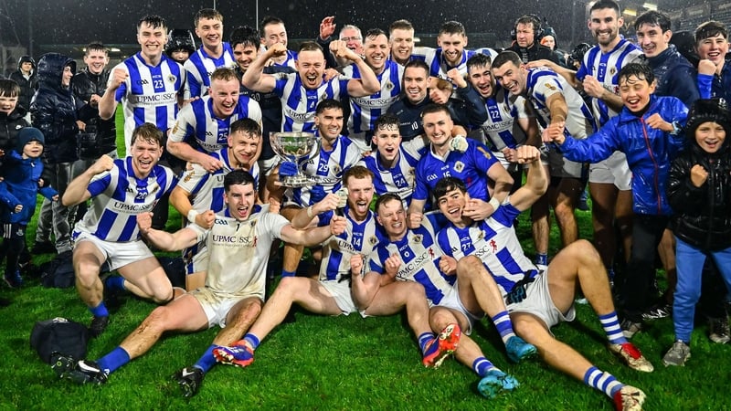 Ballyboden St Enda's players and supporters celebrate with the Clerys Perpetual Cup