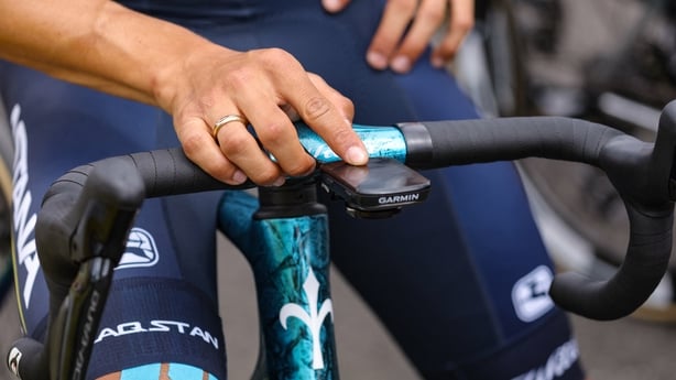A rider adjusts his Garmin cycling computer and GPS as he awaits the start of the 5th stage of the 110th edition of the Tour de France cycling race, 163 km between Pau and Laruns, in Southwestern France, on July 5, 2023. (Photo by Thomas SAMSON / AFP)