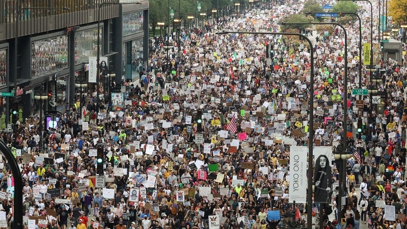 Demonstrators head north on Michigan Avenue for the 'No Kings' march in Chicago