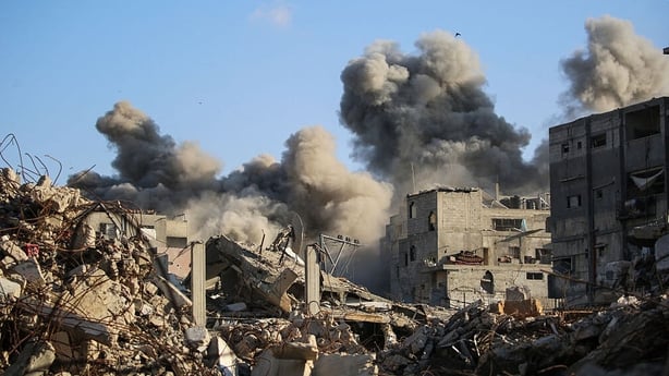 Smoke billows following an Israeli strike that targeted a building in the Bureij camp for Palestinian refugees in the central Gaza Strip 
