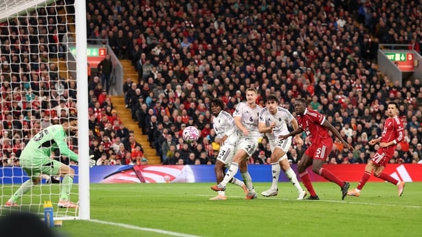 LIVERPOOL, ENGLAND - OCTOBER 19: Harry Maguire of Manchester United scores his team's second goal past Giorgi Mamardashvili of Liverpool during the Premier League match between Liverpool and Manchester United at Anfield on October 19, 2025 in Liverpool, England. (Photo by Carl Recine/Getty Images)