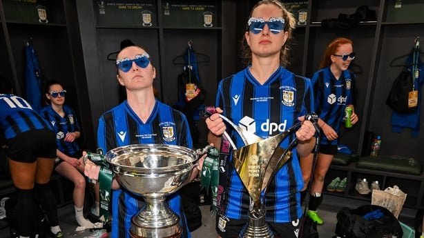 Hannah Waesch, left, and Natalie McNally of Athlone Town celebrate with the FAI Cup after the 2025 Sports Direct Women's FAI Cup Final match between Athlone Town and Bohemians at Tallaght Stadium