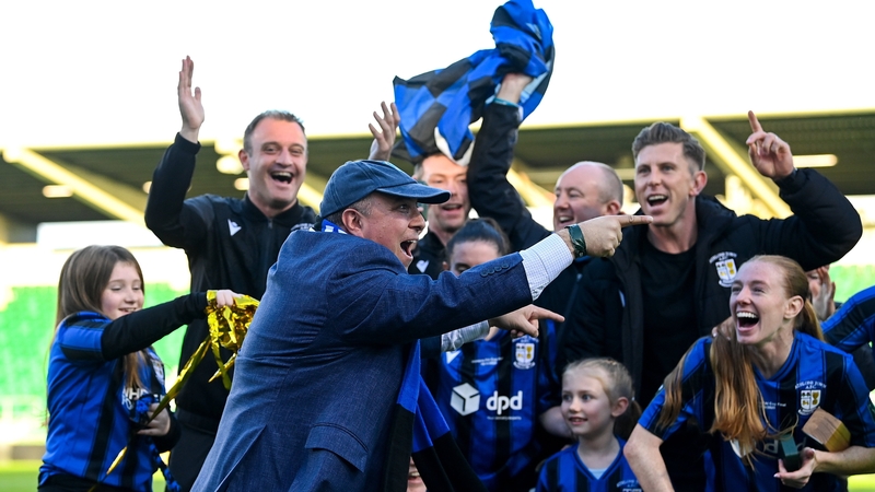 Athlone Town owner Nick Giannotti, wearing a baseball cap, celebrates their cup success