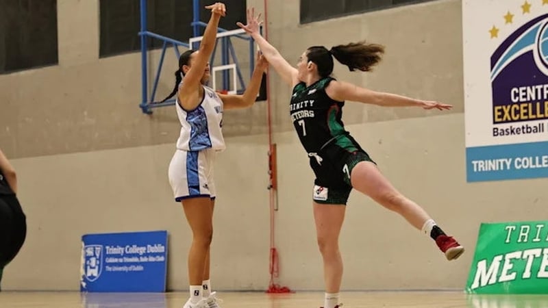 Sarah Hickey of SETU Waterford Wildcats (L) in action against Trinity Meteors